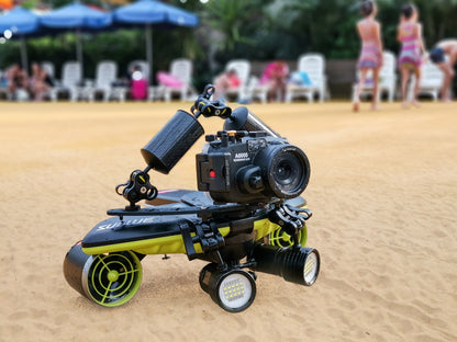 Navbow photographic base plate with camera and lights on sandy beach