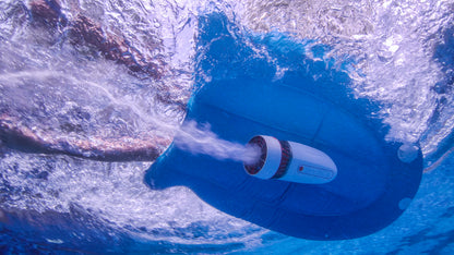 Underwater shot of Tini inflatable kickboard and scooter generating bubbles in clear water.