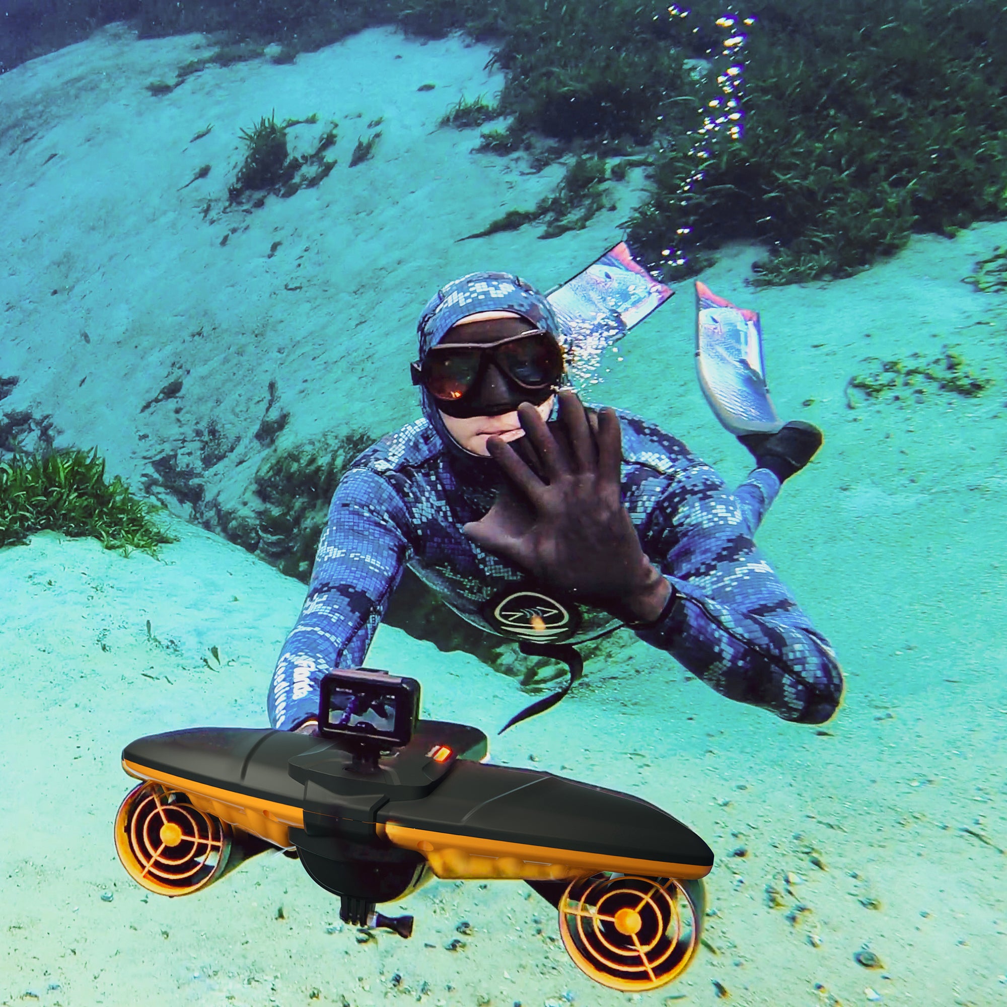 Diver waving while using SUBLUE Navbow+ underwater scooter in clear water.