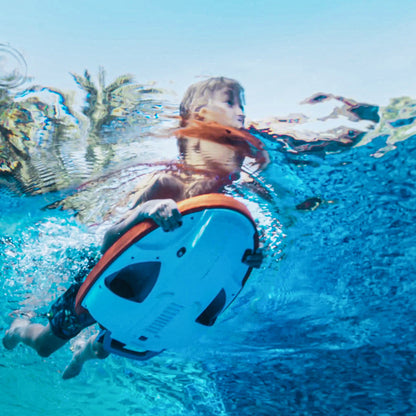 Child using SUBLUE Swii Electronic Kickboard underwater in a blue pool.