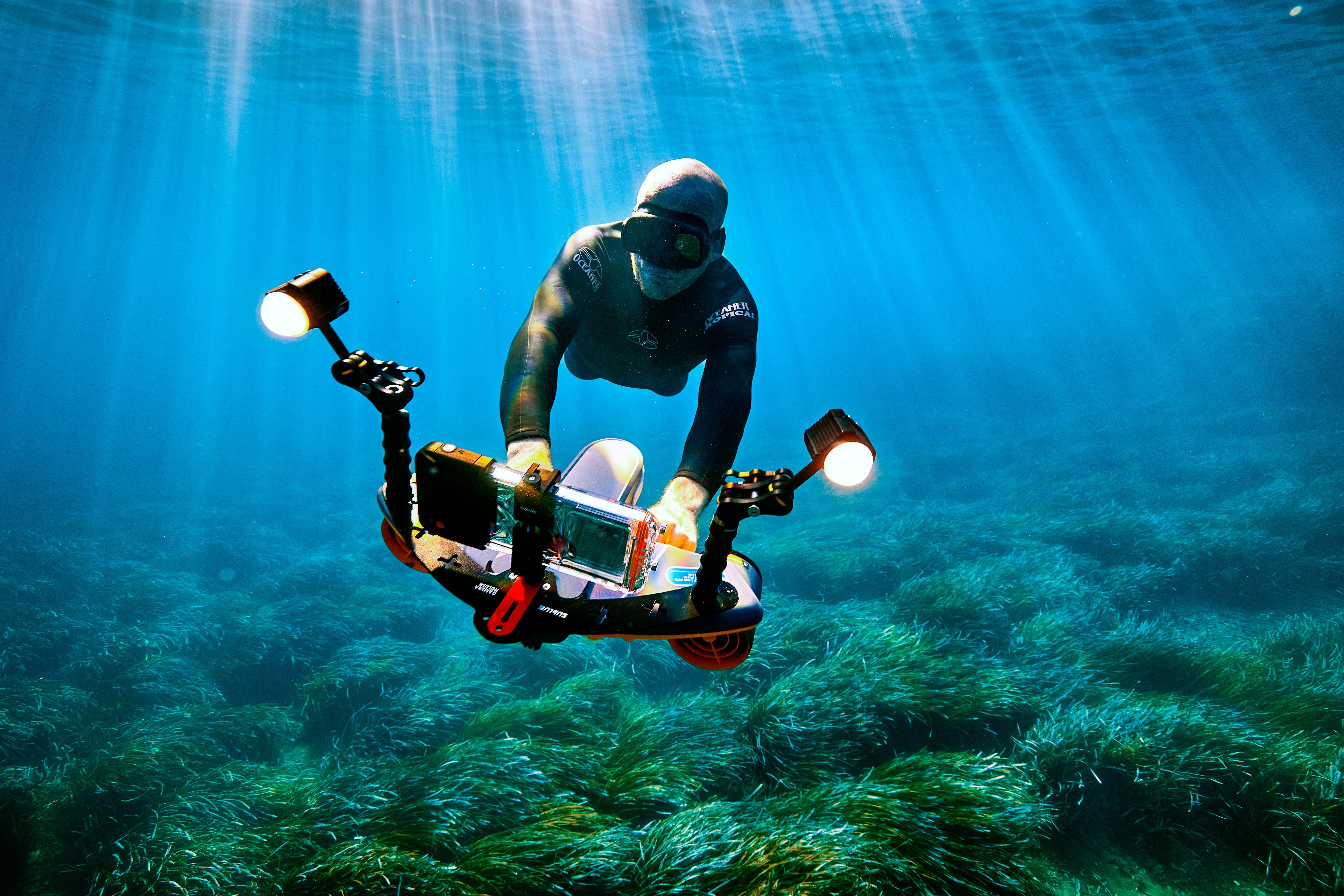 Diver operating Sublue Waterproof LED Light for underwater exploration