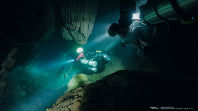 Diver using Navbow+ Counterweight Pack in underwater cave exploration.
