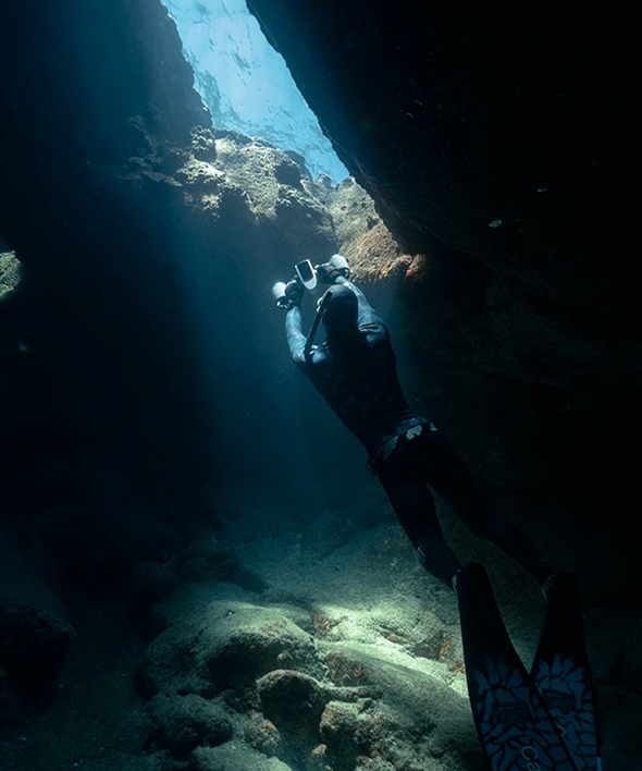 a person underwater with a camera