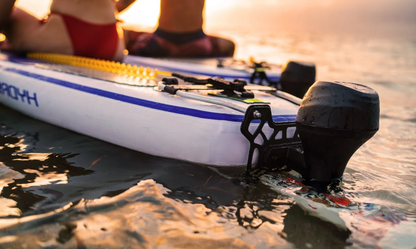 Tini Double-Engine Support Handle on underwater scooters in serene water setting