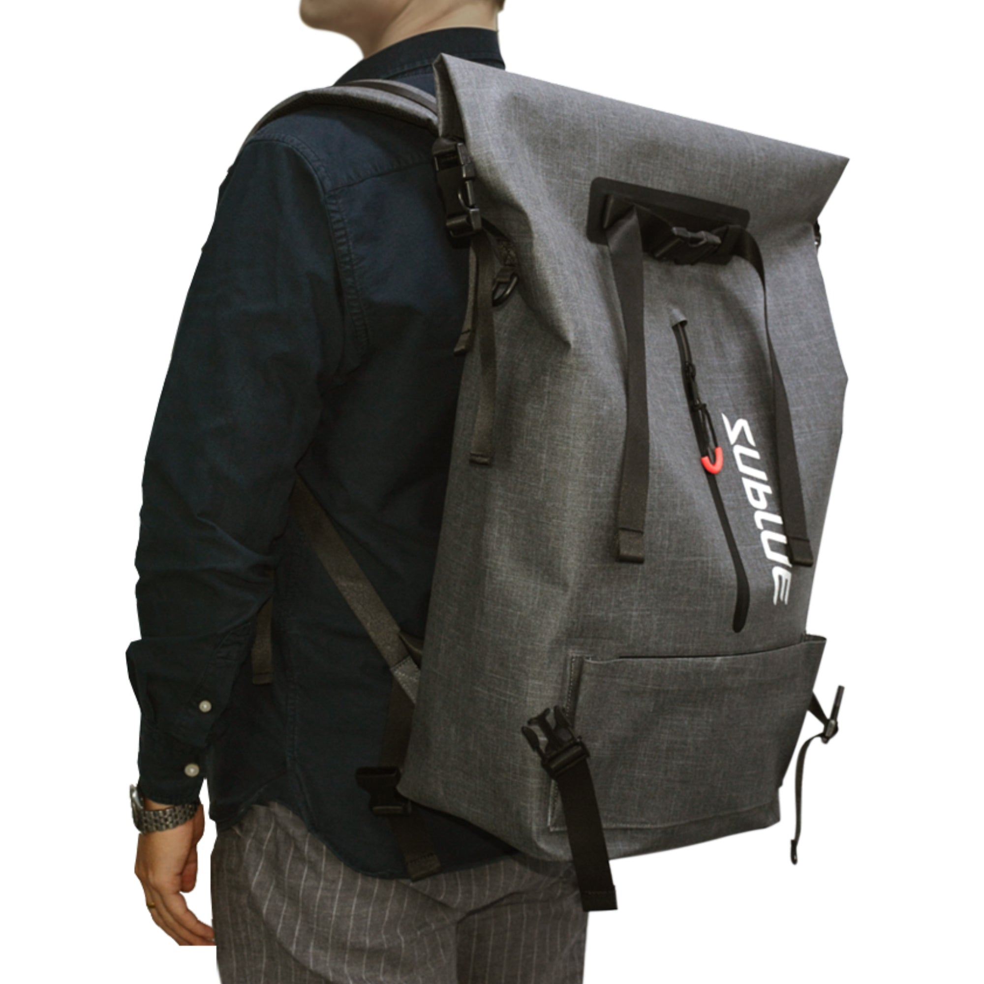 Person wearing grey Sublue waterproof backpack with roll-top closure and side pockets.