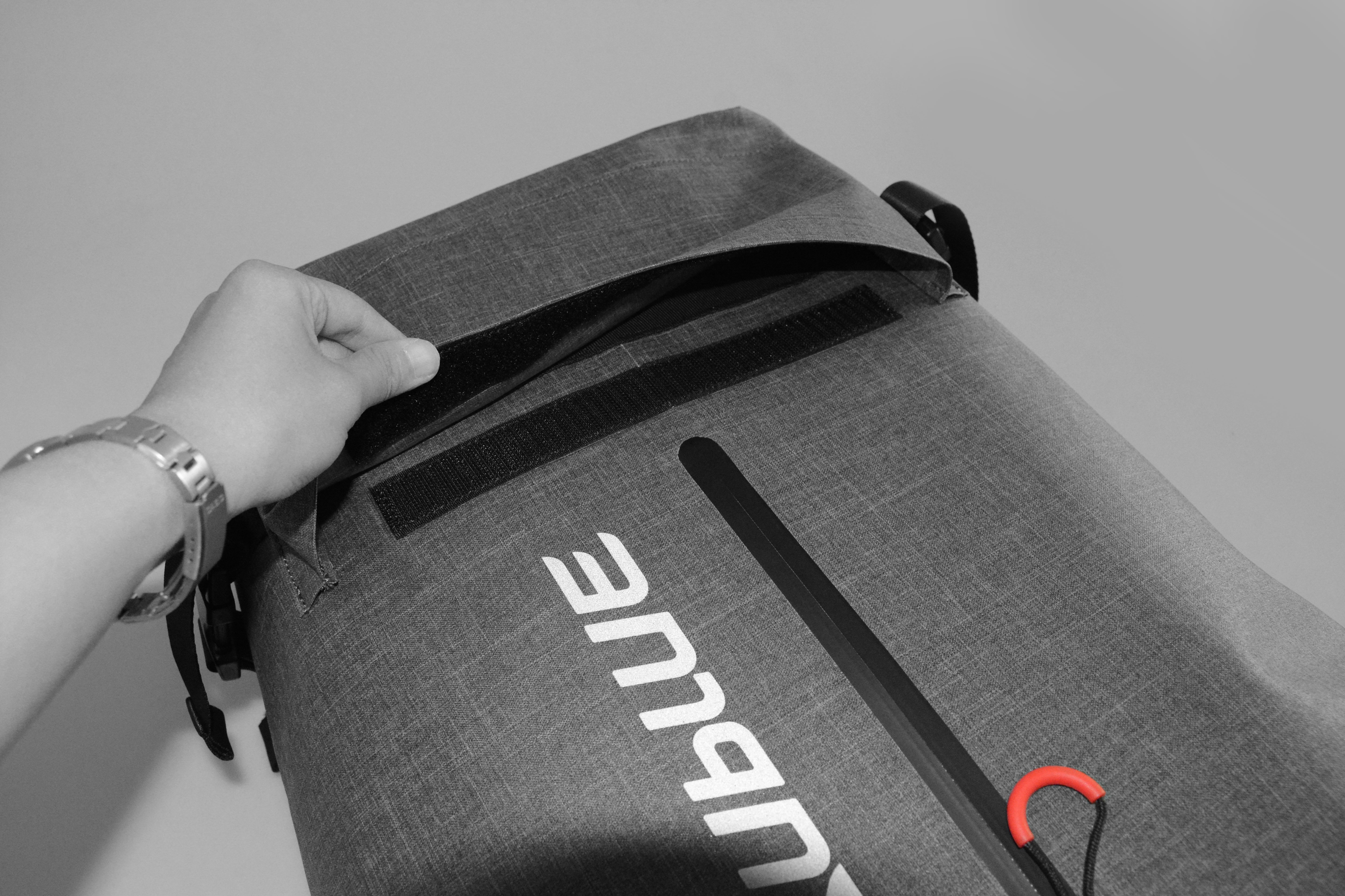 Open roll-top of Sublue waterproof backpack showing interior pocket