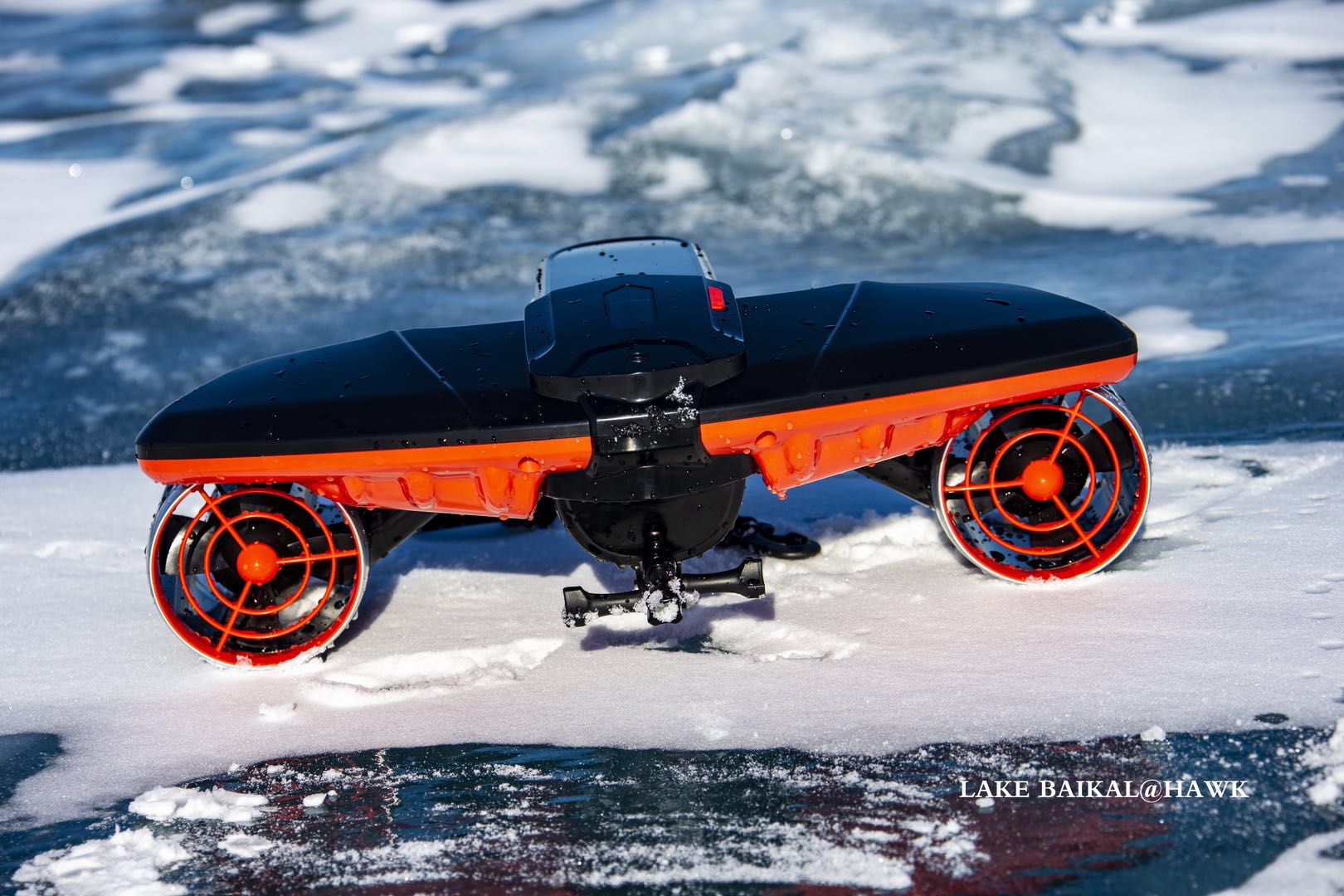 Black and red Navbow scooter front cover on icy surface