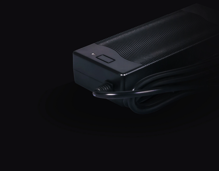 a black rectangular object with a cord
